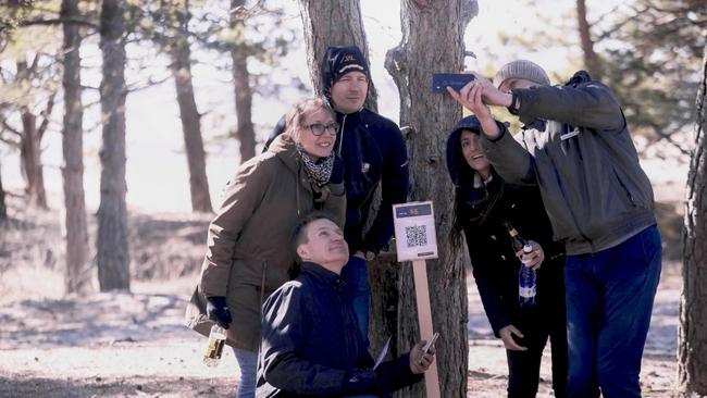 Group of people taking a selfie.